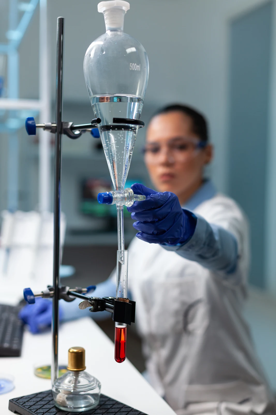Scientist working with heat-resistant borosilicate laboratory glassware