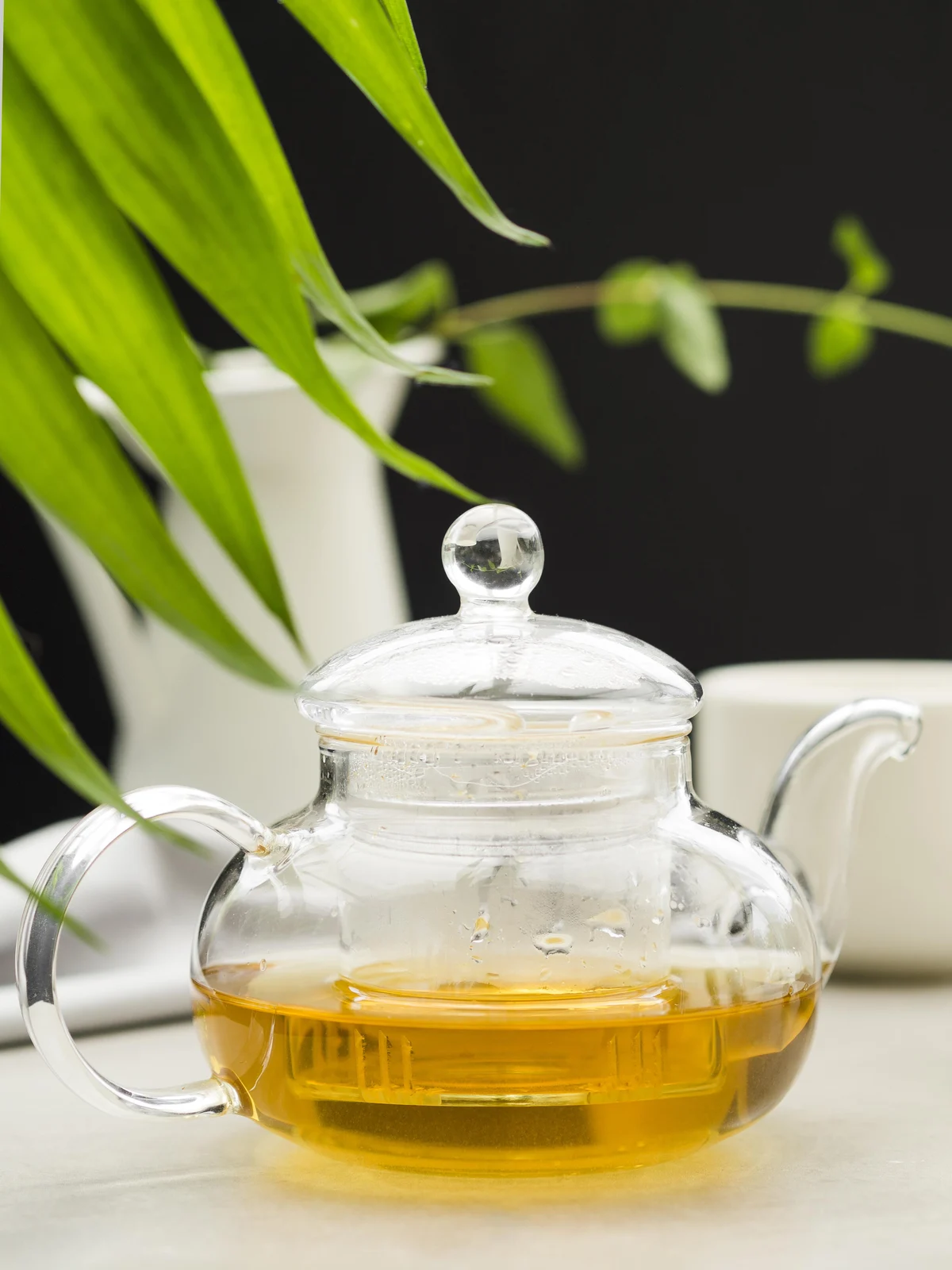 Clear borosilicate glass teapot filled with hot tea