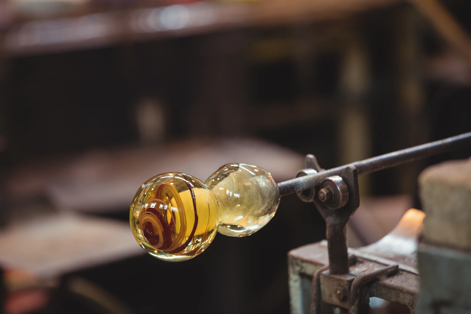 Molten glass gathered on a blowpipe during forming
